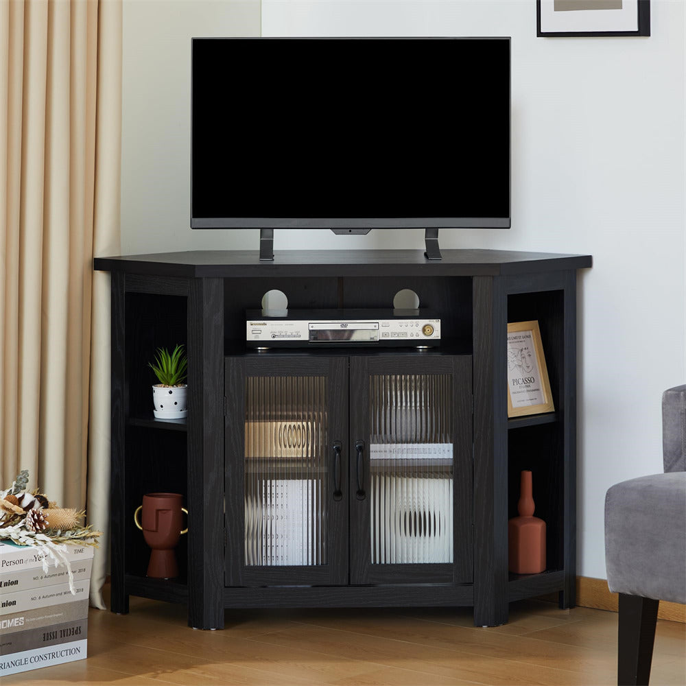 Black corner TV stand with a television mounted on it, featuring glass doors and shelves.