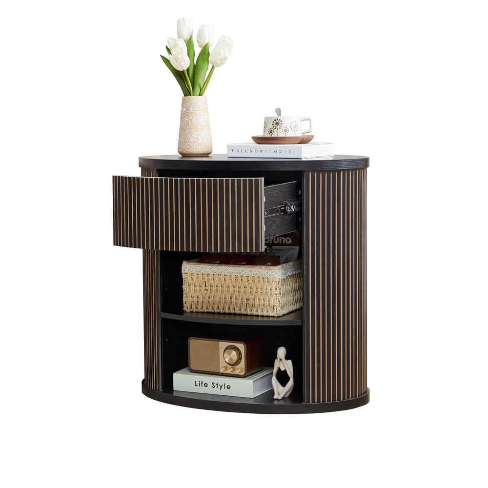 Round wooden side table with decorative items on a white background