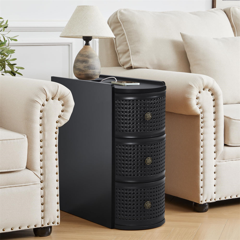 Black side table with woven design in a living room setting