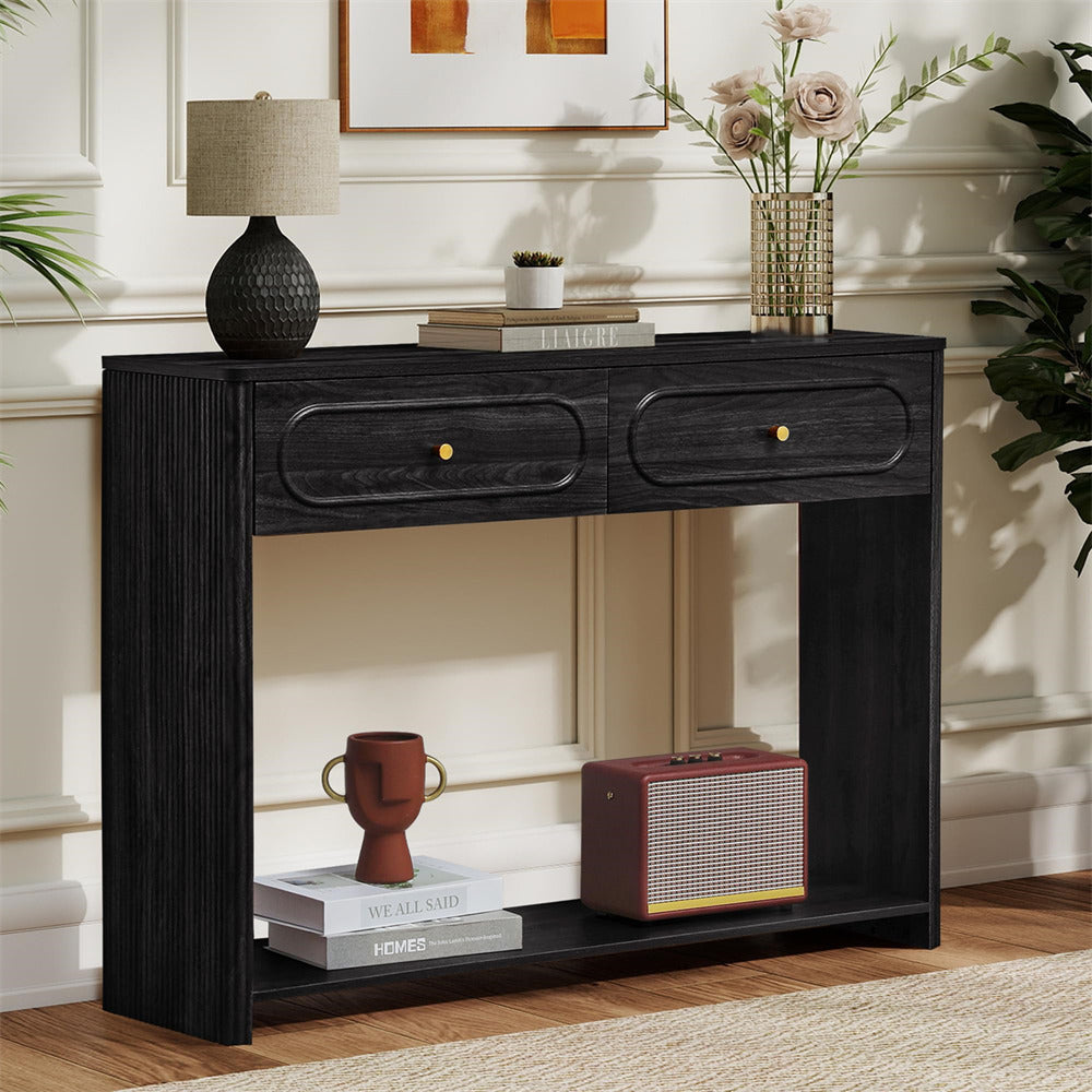 Black console table with decorative items in a living room setting