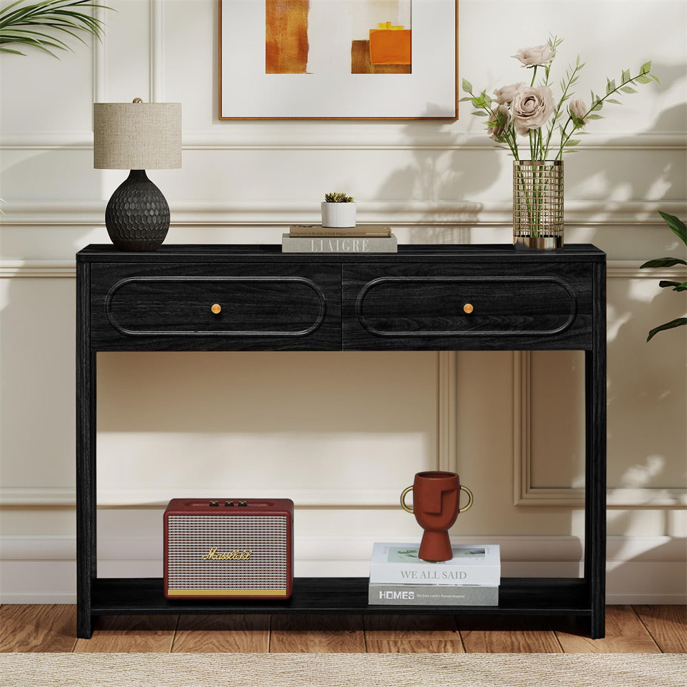 Black console table with decorative items in a room setting