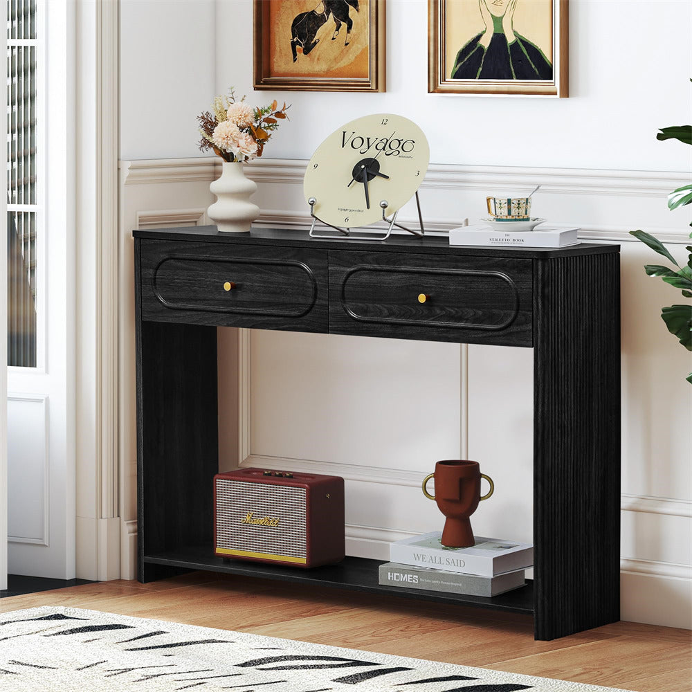 Black console table with decorative items in a room setting