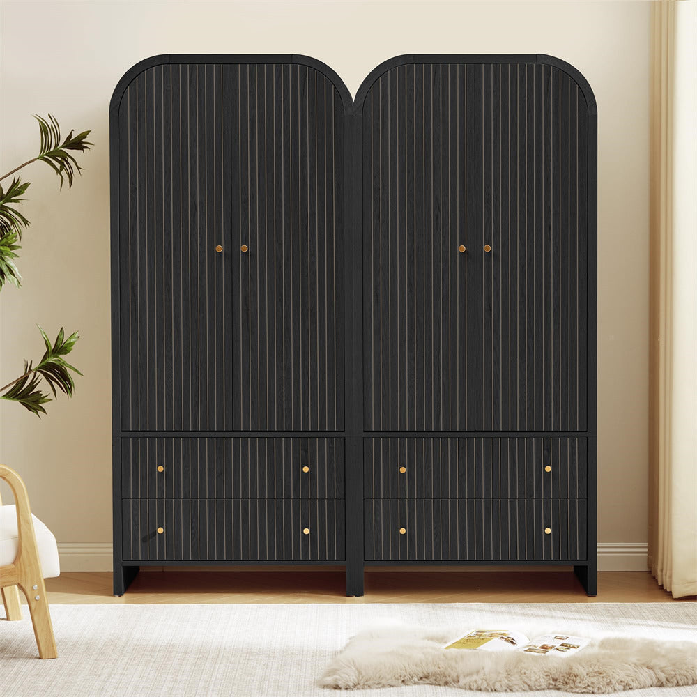 Black wardrobe with gold knobs in a room setting