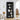 Black bookshelf with decorative items in a living room setting