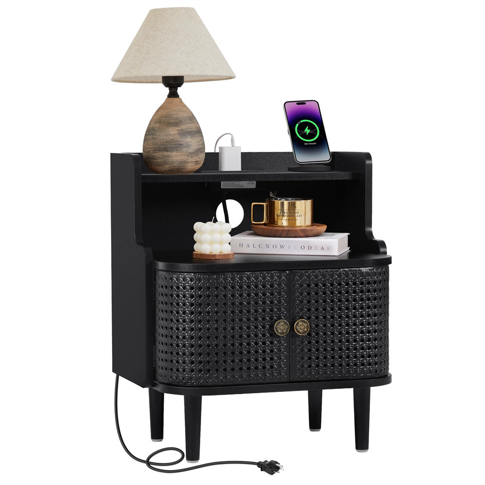 Black woven nightstand with lamp, phone, and decor items on a white background
