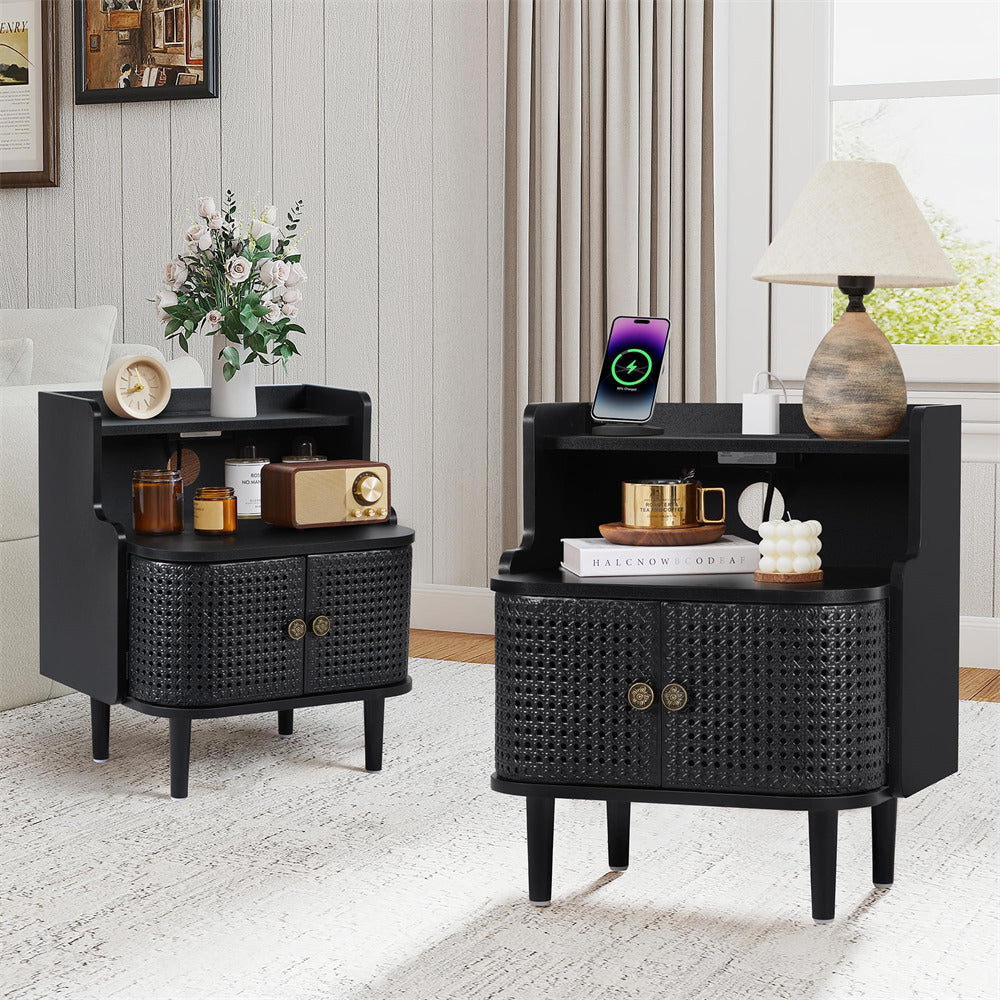 Two black wicker nightstands with decorative items in a room.