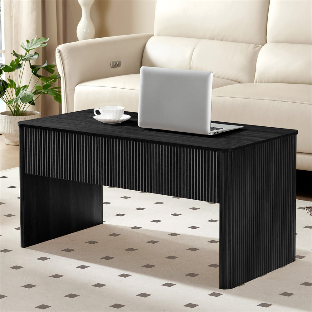 Black coffee table with a laptop and cup in a living room setting