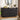 Black 6-drawer dresser with decorative items in a room setting