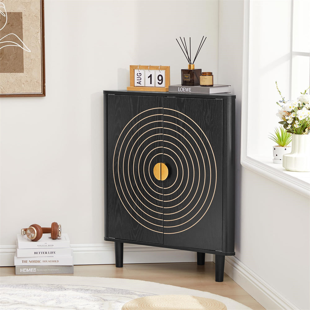 Black cabinet with gold circular design in a room with books and decor items.