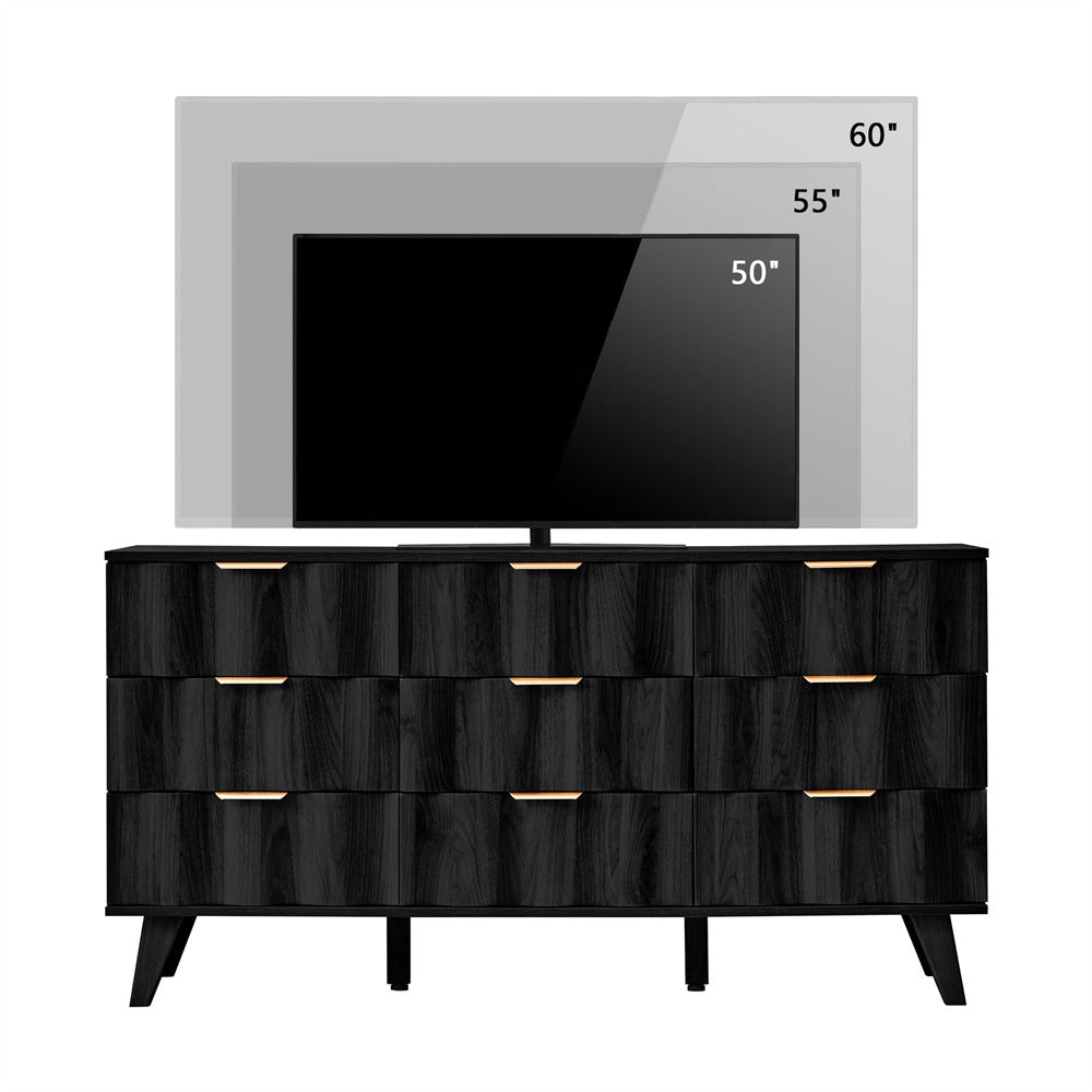 Black dresser with gold handles in front of a television displaying temperature readings.