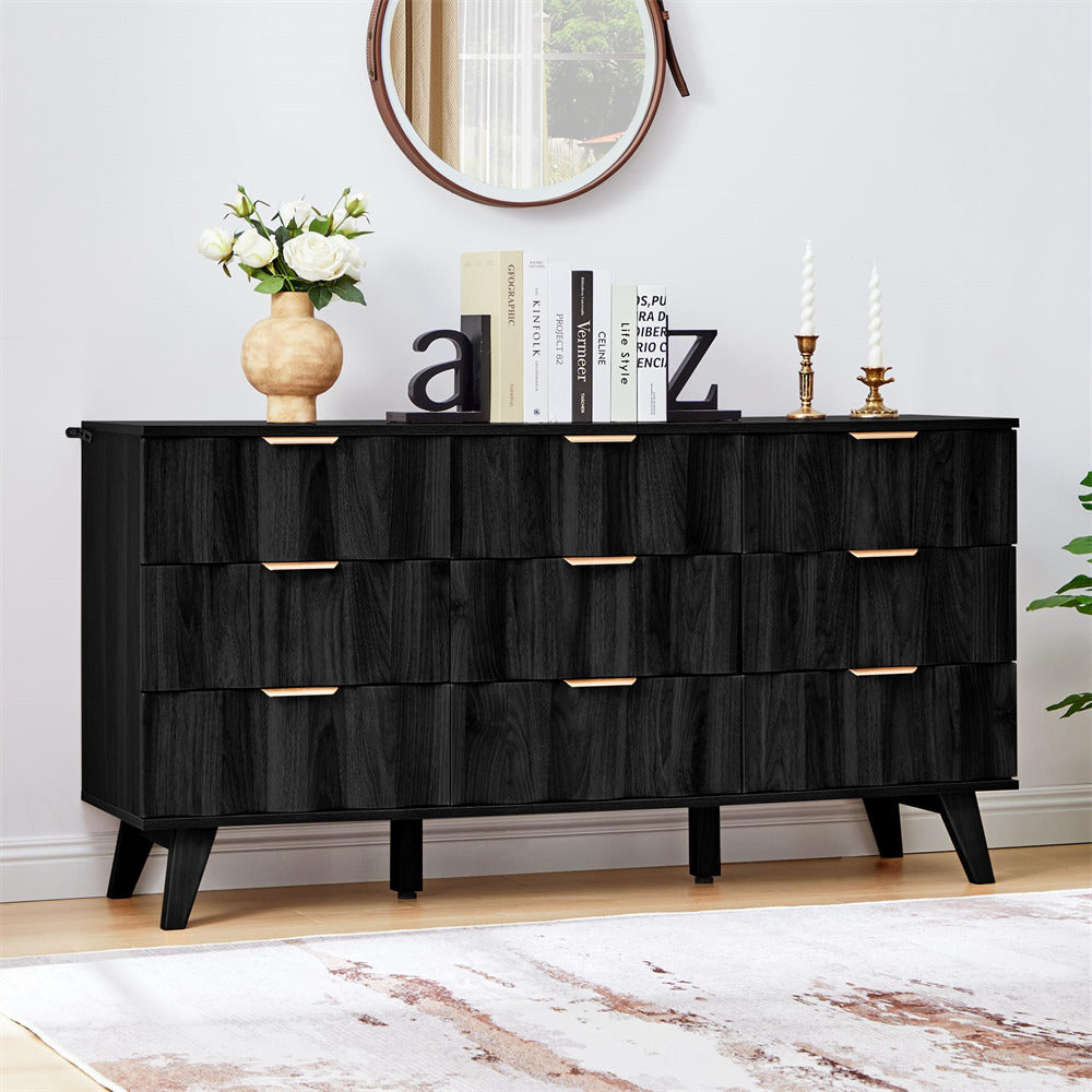 Black dresser with decorative items in a room setting