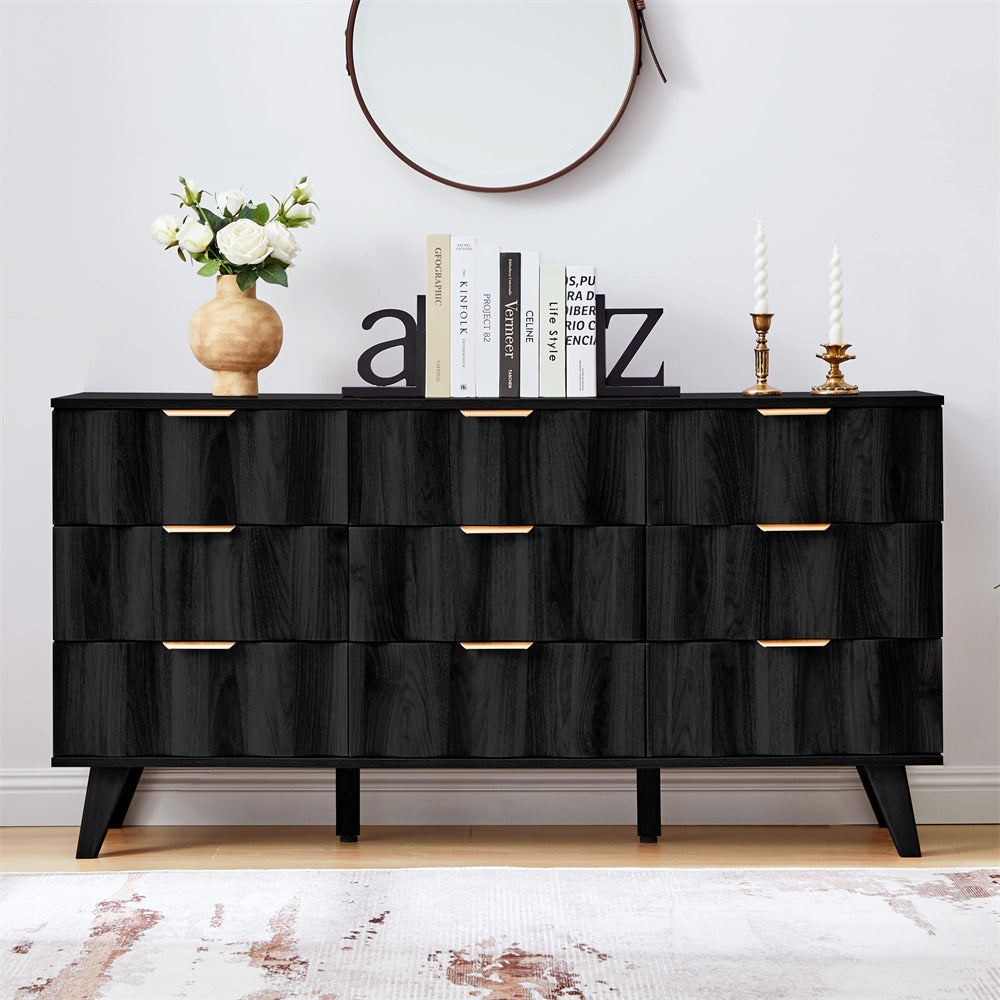 Black dresser with decorative items against a white wall