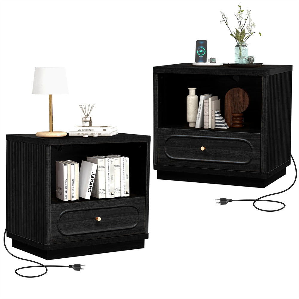 Two black nightstands with books, a lamp, and decorative items on a white background