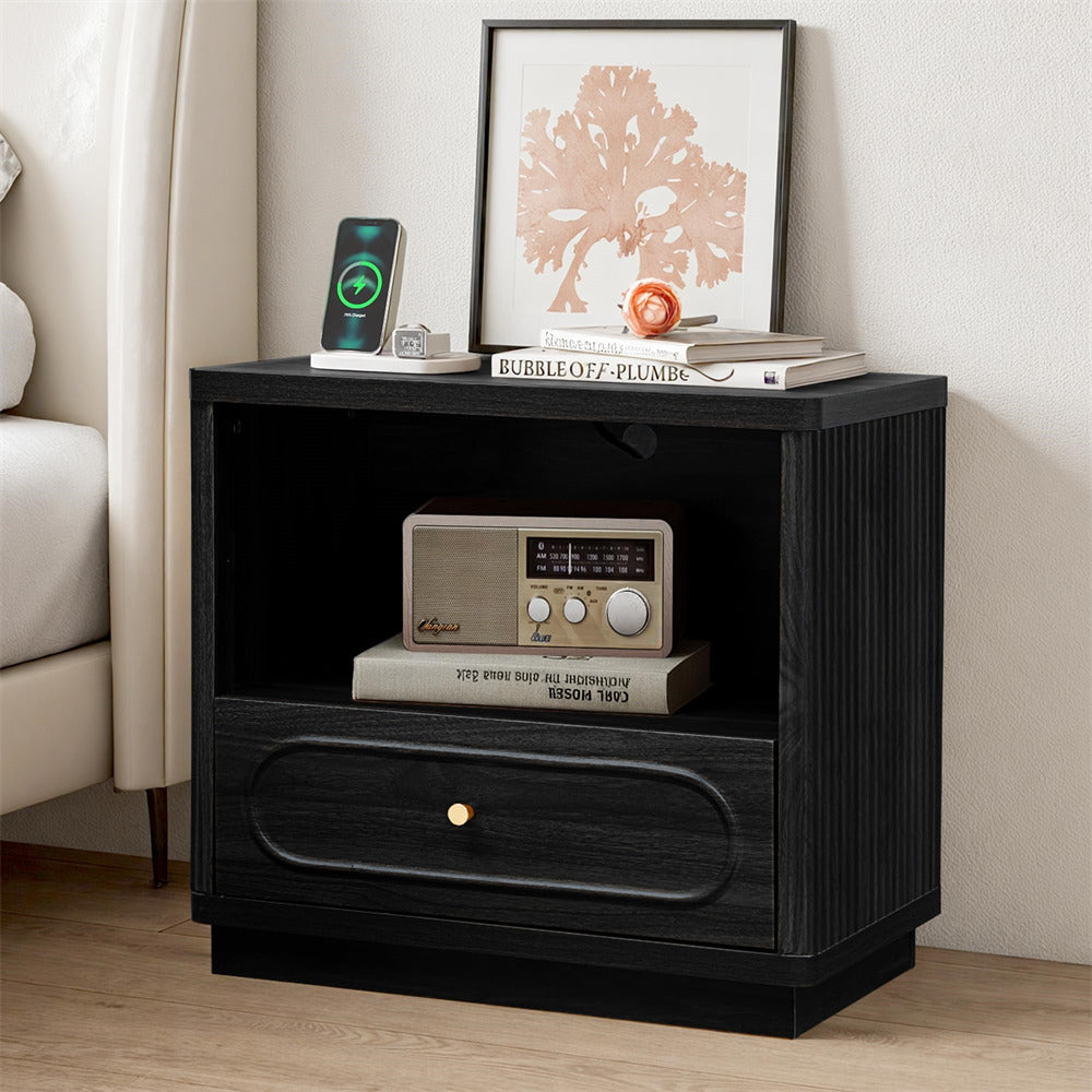 Black nightstand with decorative items in a room setting