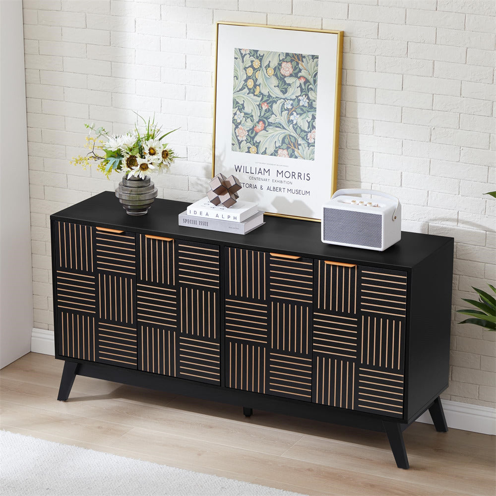 Black sideboard with geometric pattern in a room with a white brick wall and framed artwork.