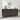 Black patterned sideboard with decorative items against a white brick wall.