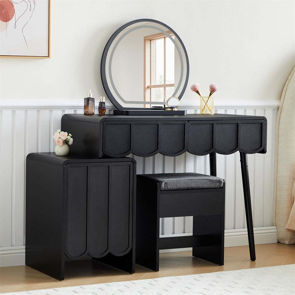 Black vanity table with mirror and stool in a room setting