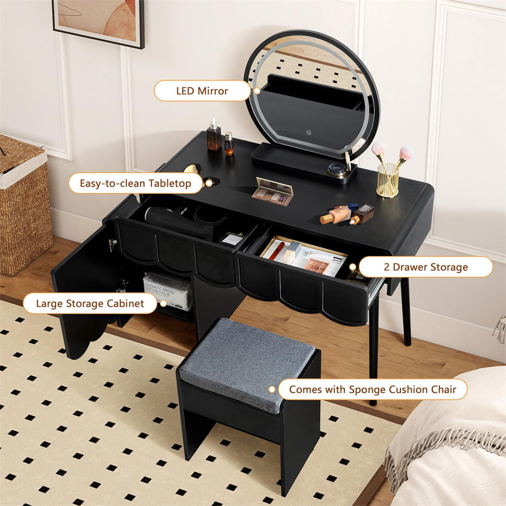 Black vanity table with LED mirror, storage drawers, and cushioned stool in a room setting.