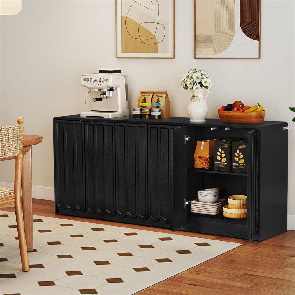 Black storage cabinet in a room with a coffee machine, fruit bowl, and decorative items.