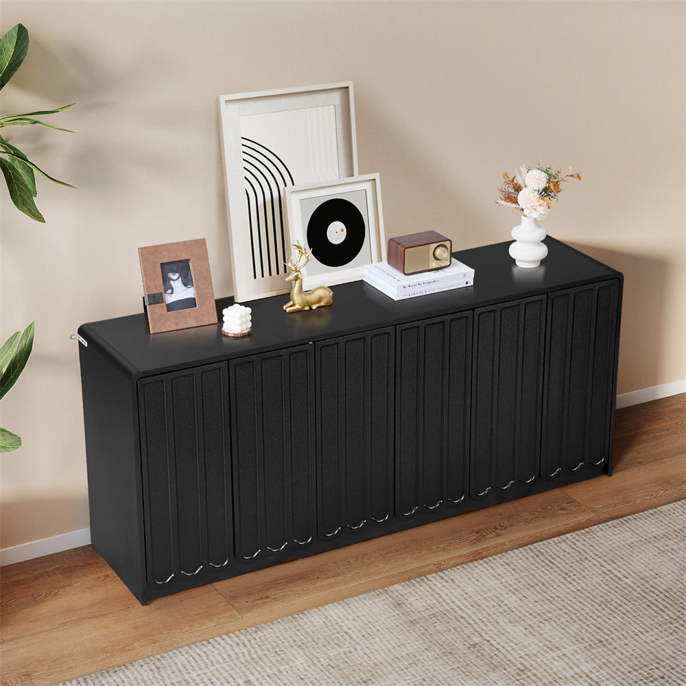 Black sideboard with decorative items against a beige wall