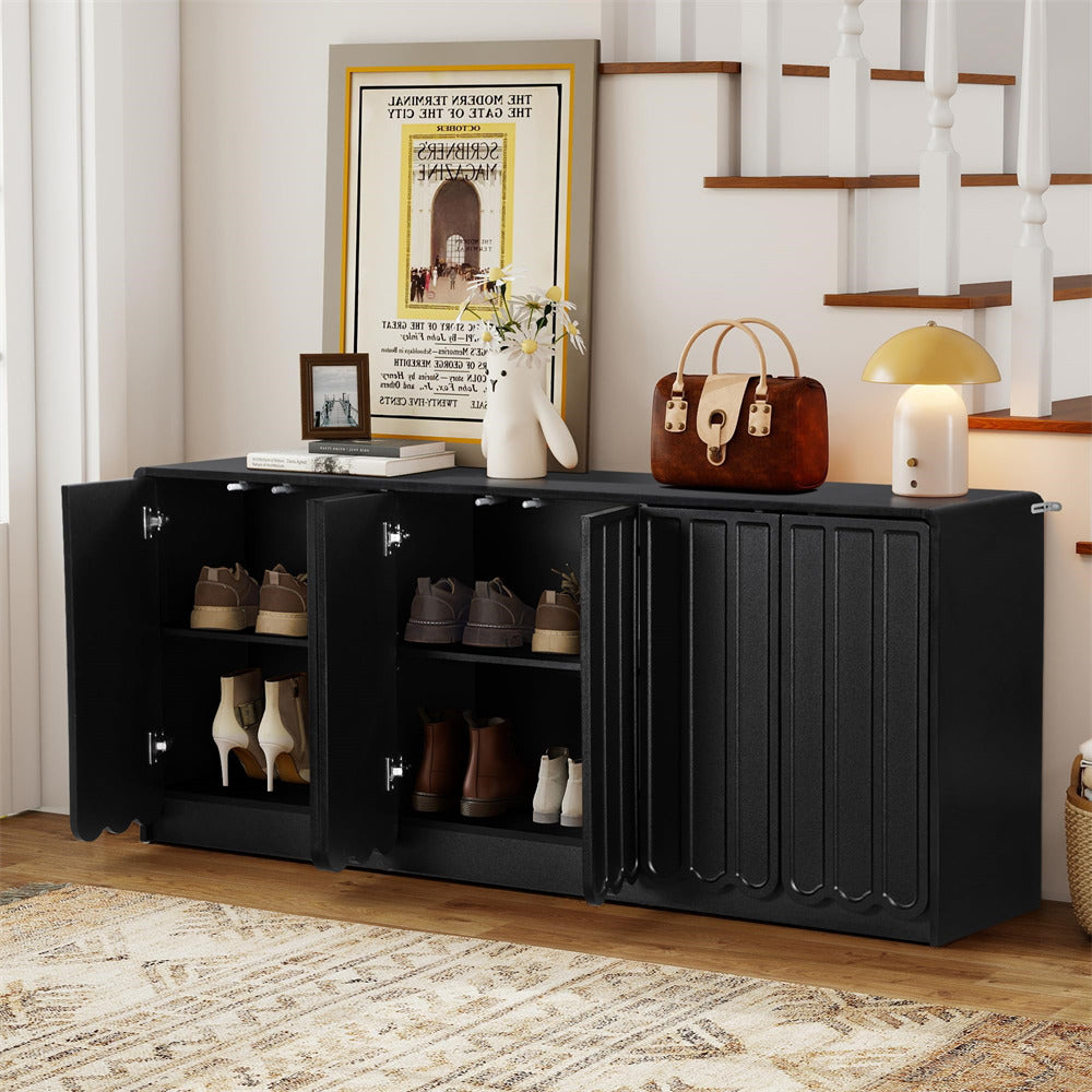 Black shoe cabinet with shoes inside, placed in a room with a staircase and decor items.