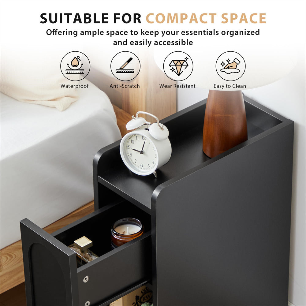 Black nightstand with clock, lamp, and other items in a bedroom setting