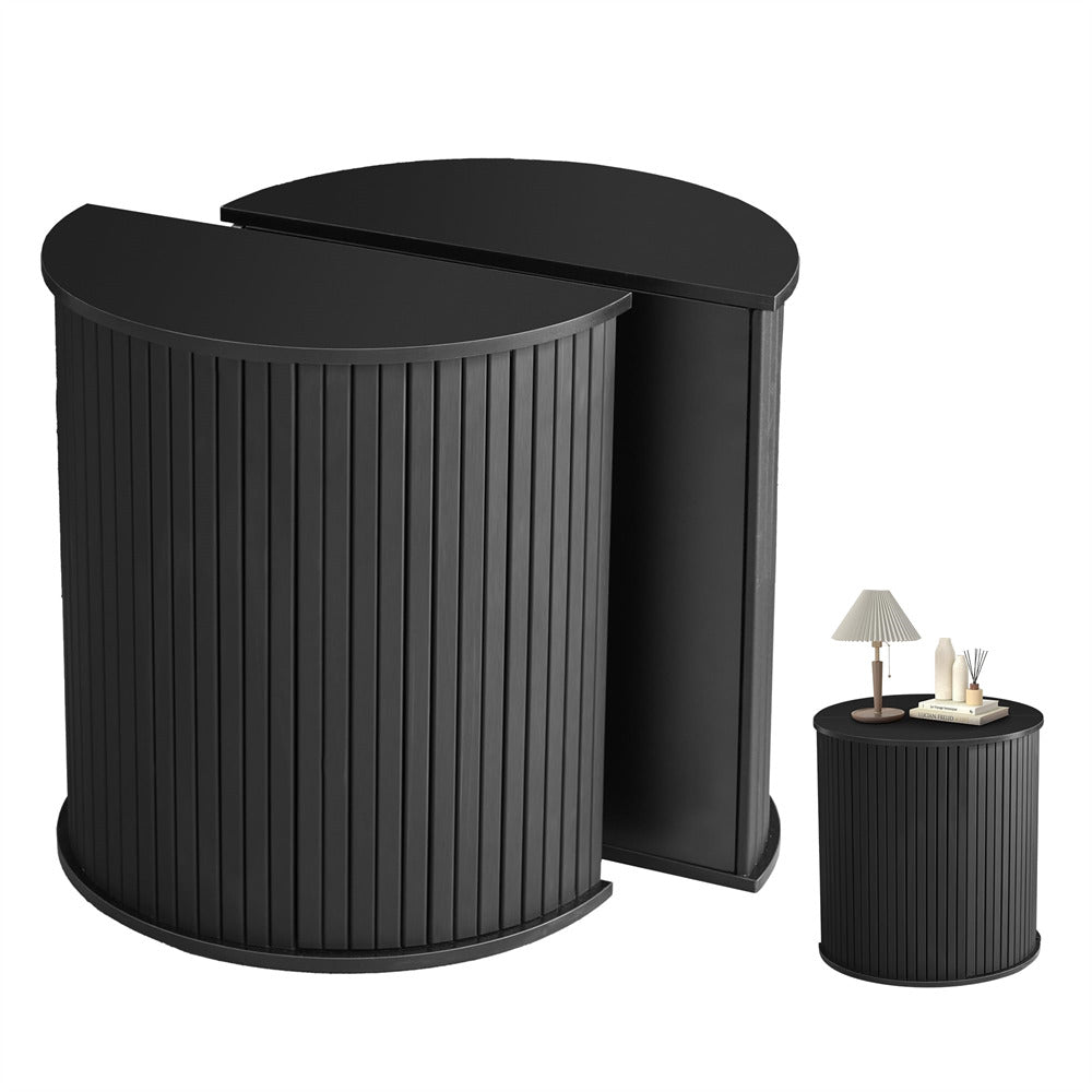 Set of black side tables with a smaller table displaying decorative items on a white background
