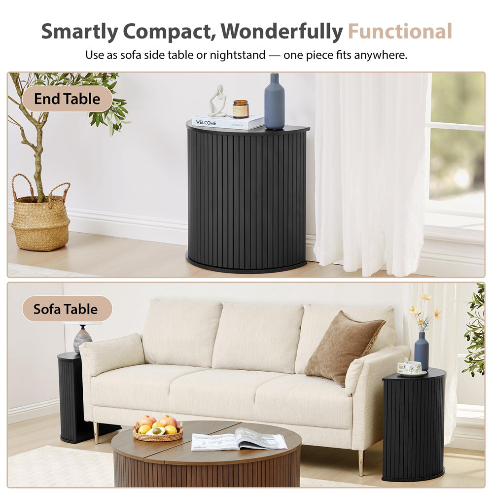 Black side table used as a sofa table and nightstand in a living room setting.