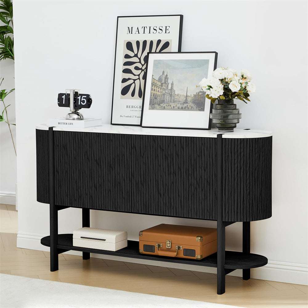 Black console table with decorative items in a room setting