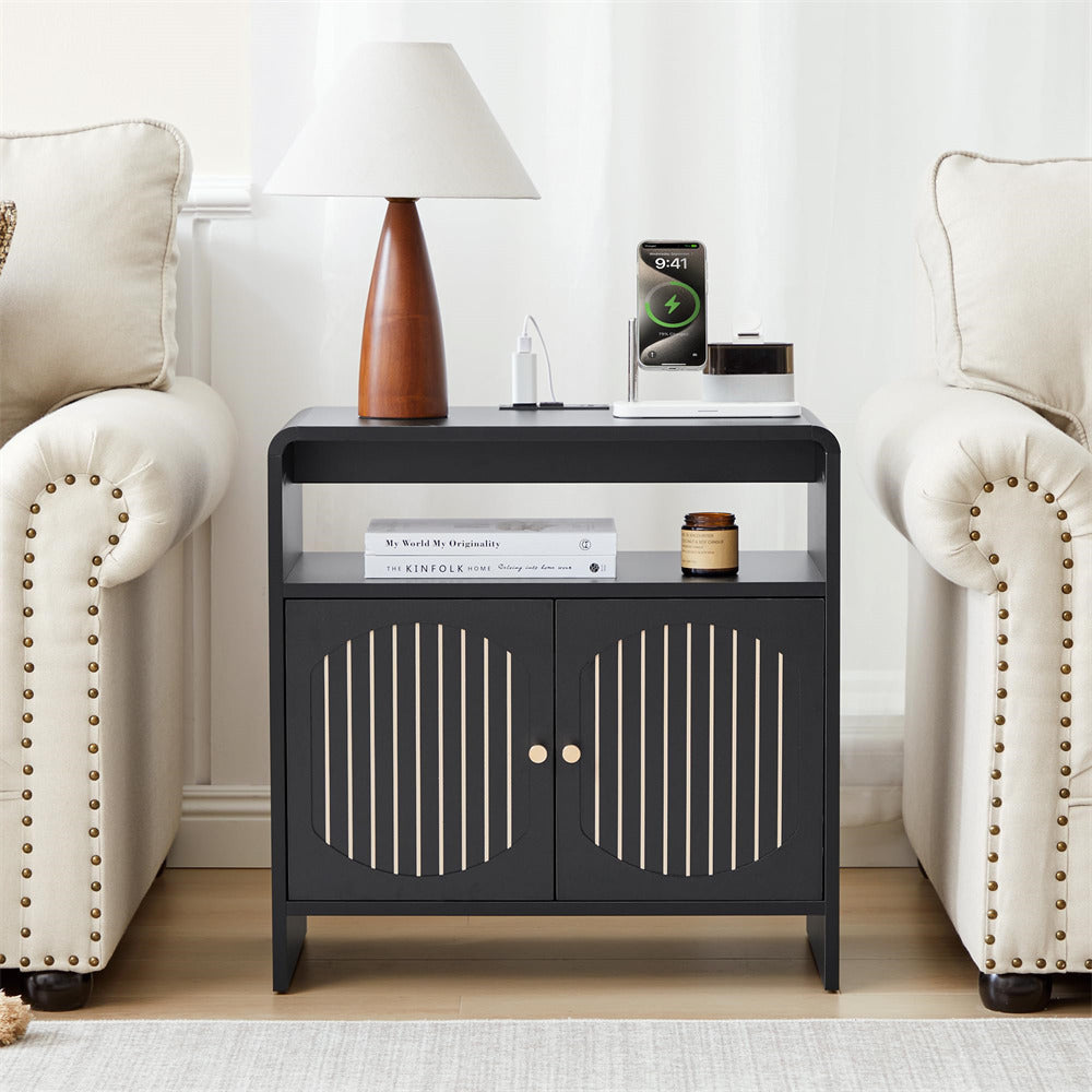 Black side table with decorative items in a living room setting