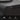 Close-up of a black nightstand corner with a dashed measurement circle marking 0.59 inches, plus feature icons below stating Wooden Nightstand, Waterproof Desktop, and Stable and Sturdy.