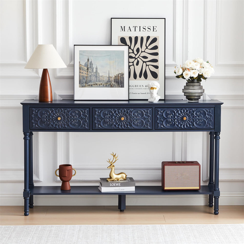 Navy blue console table with decorative items in a room with white walls.
