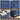 Collage of a blue cabinet with floral embossing, gold handles, and decorative elements.