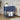 Navy blue side table with decorative elements in a living room setting