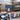 Blue storage table with drawers and open shelf in a living room setting