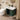 Bathroom with a green vanity unit, white sink, and toilet.