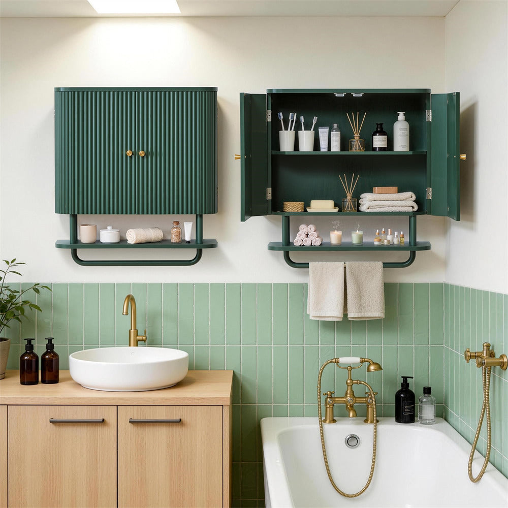 A styled bathroom interior showing two dark green wall-mounted storage cabinets/shelving units. One cabinet is closed, and the other is open to display toiletries, towels, and accessories.