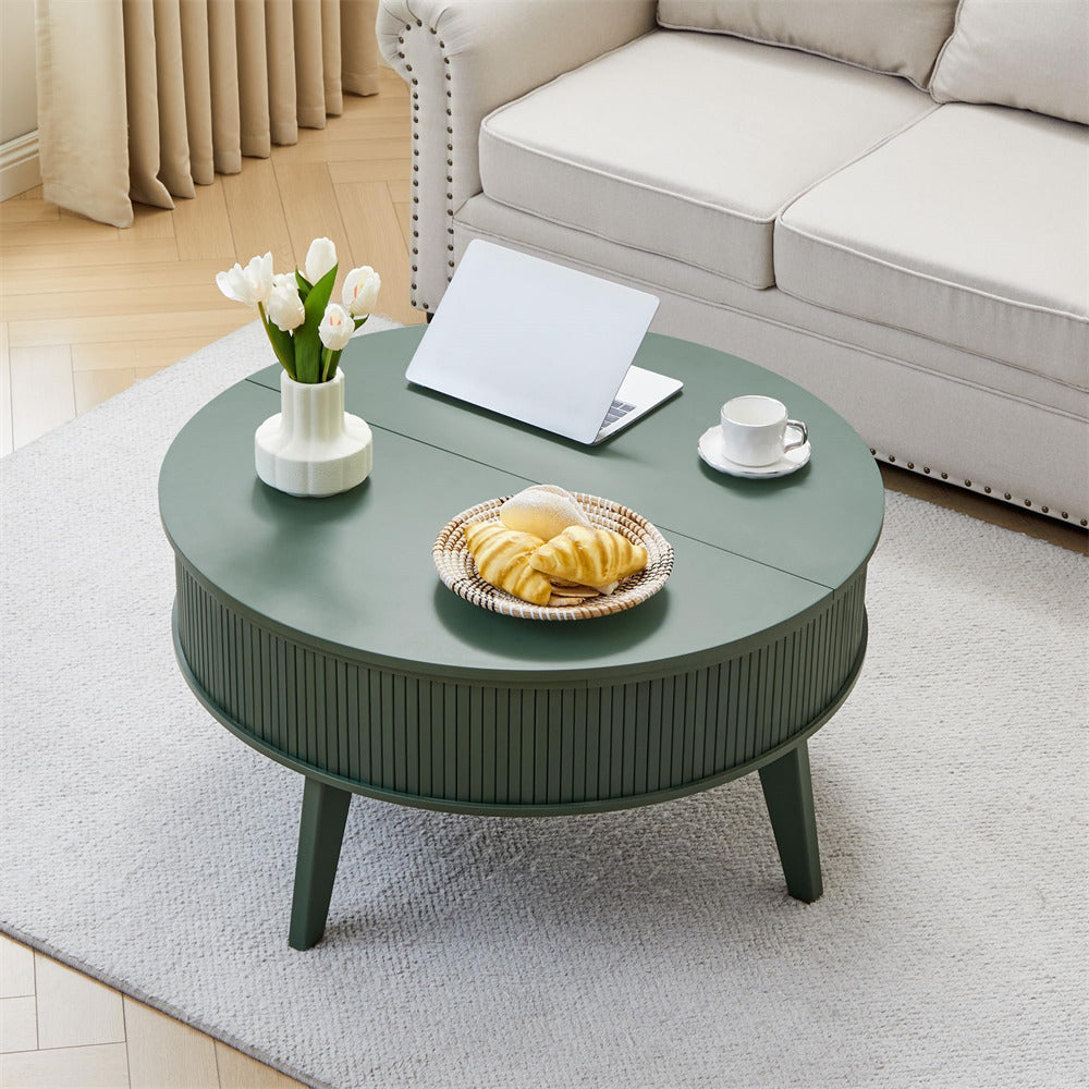 Round green coffee table with a laptop, cup, and bread in a living room setting.