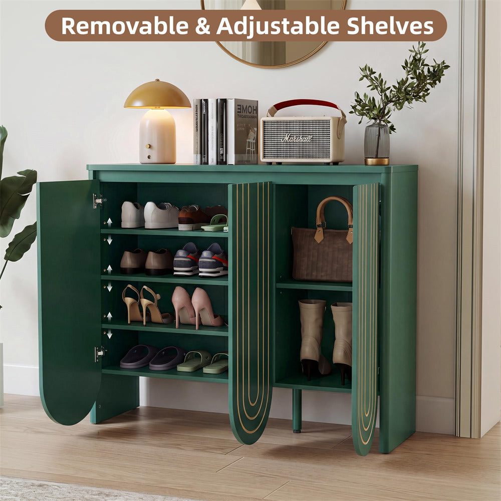 A green entryway shoe cabinet with open doors and removable shelves, styled in a home entryway with shoes, books, a lamp, a radio, a handbag, boots, and a plant.