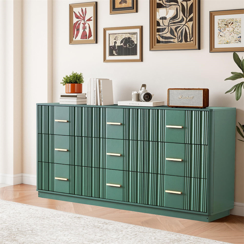 Green 9 drawers dresser with gold handles in a room with framed art on the wall.