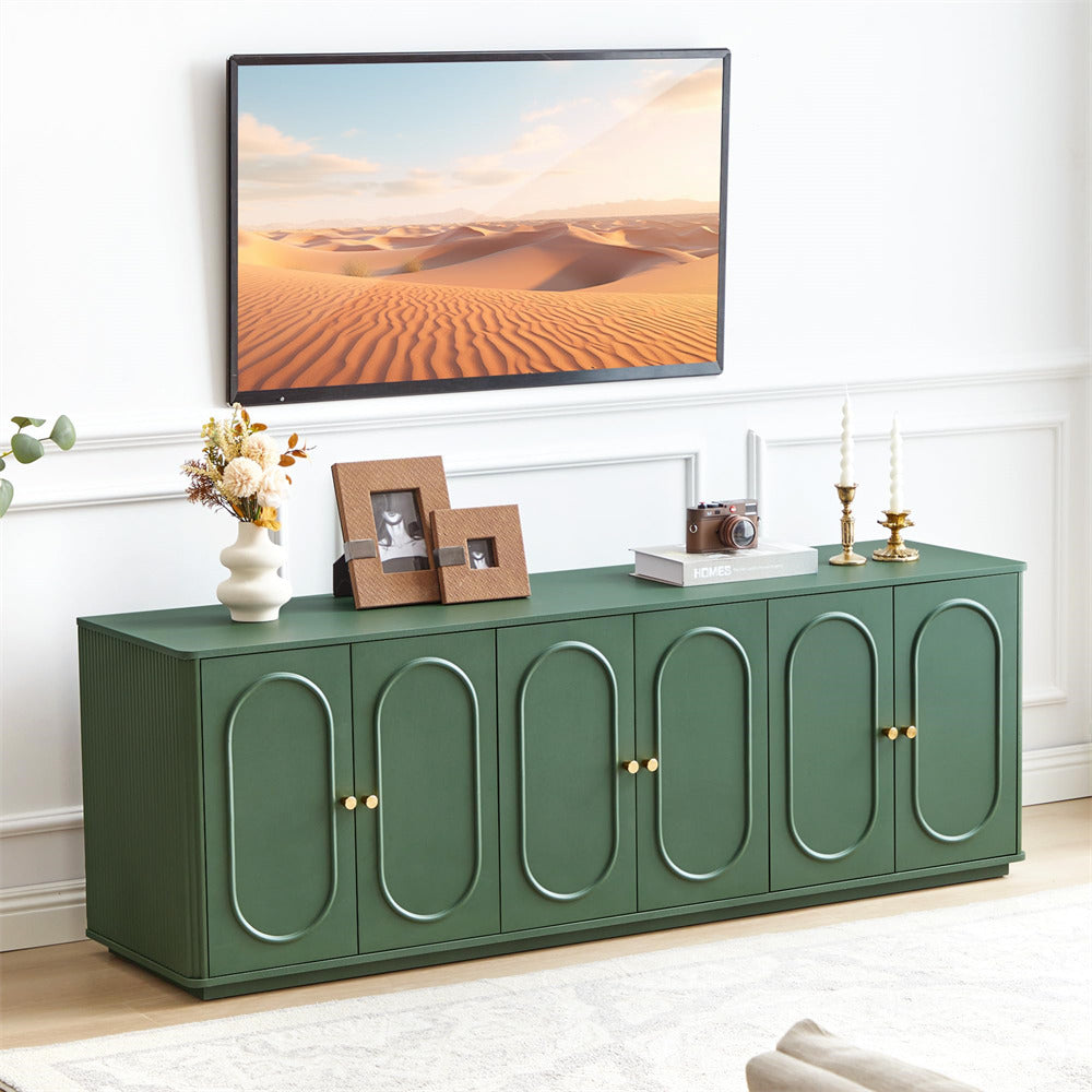 Green entertainment console with decorative items in a living room setting