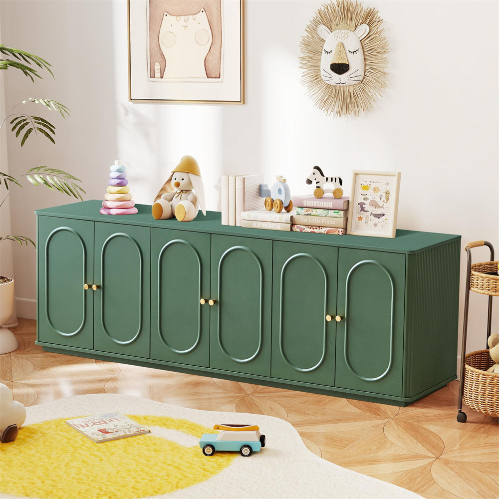 Green cabinet in a room with toys and decor