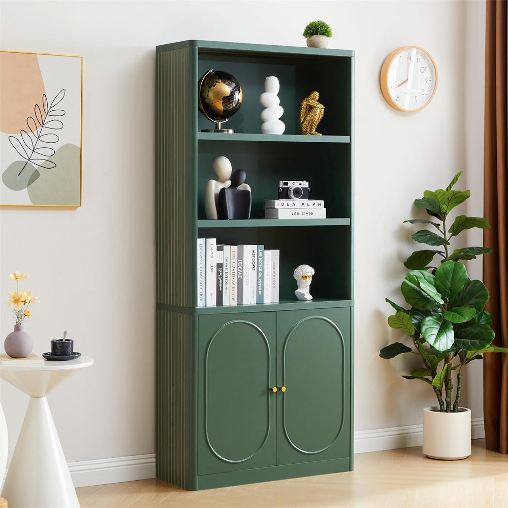 Green bookshelf with decorative items in a room with a plant and wall art.