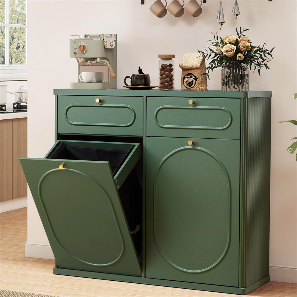 Green kitchen cabinet with one door open, displaying a trash bin inside, in a kitchen setting.