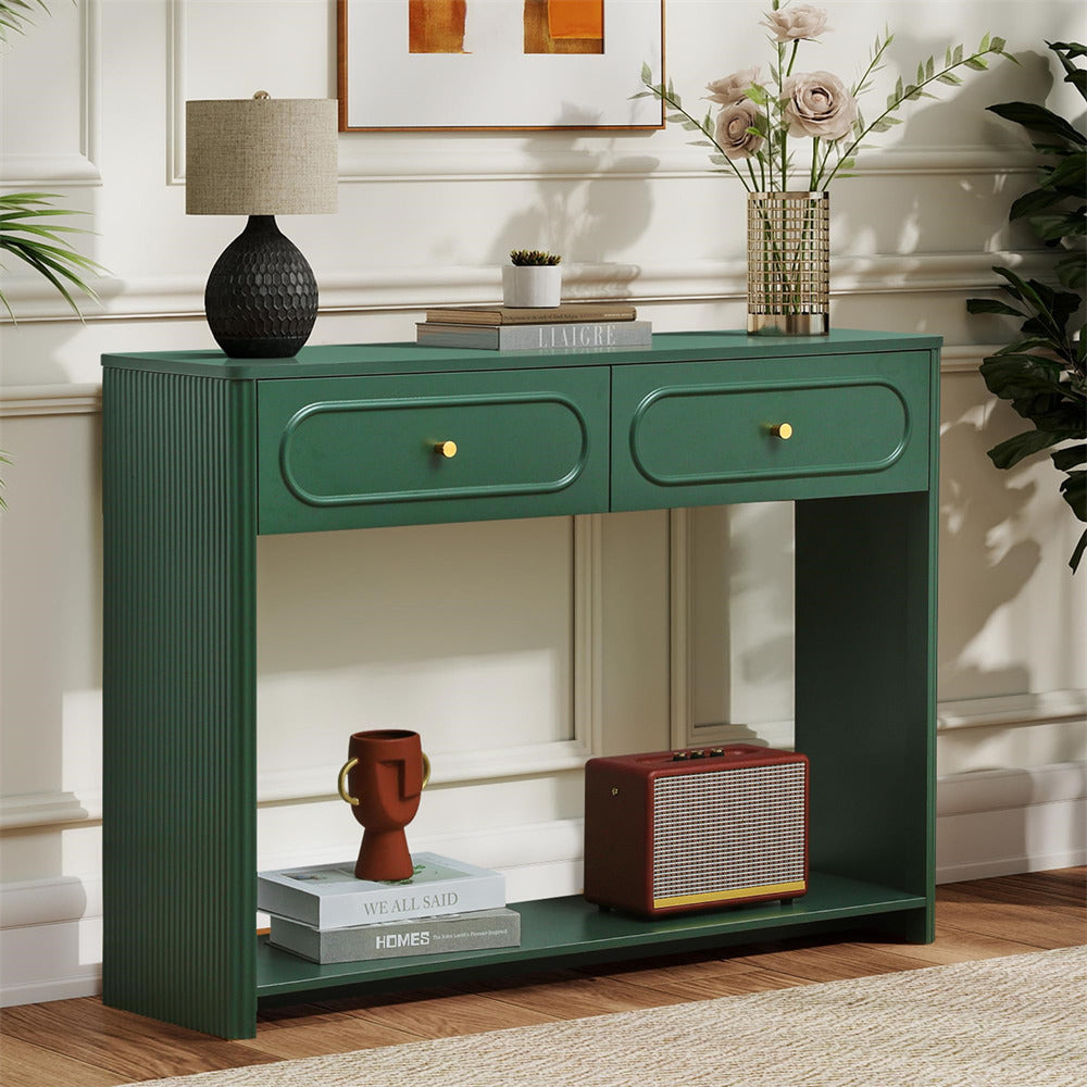 Green console table with decorative items in a room setting