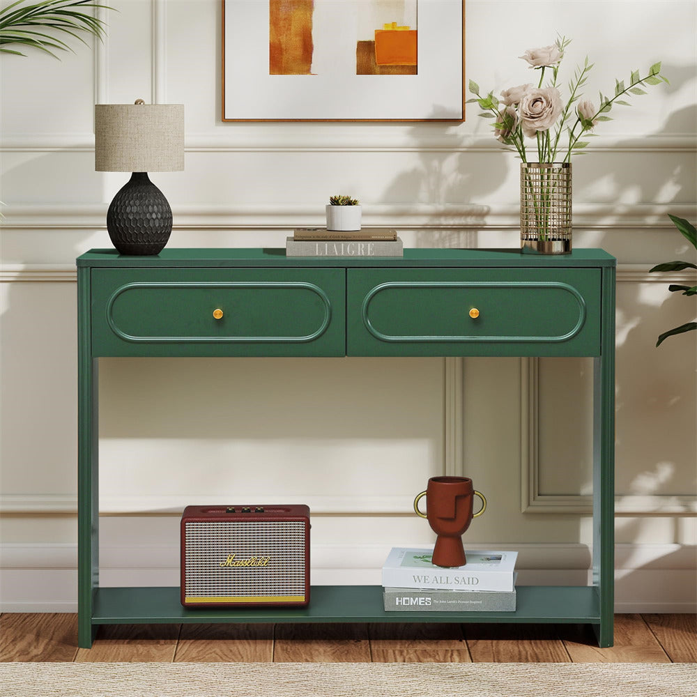 Green console table with decorative items in a room setting