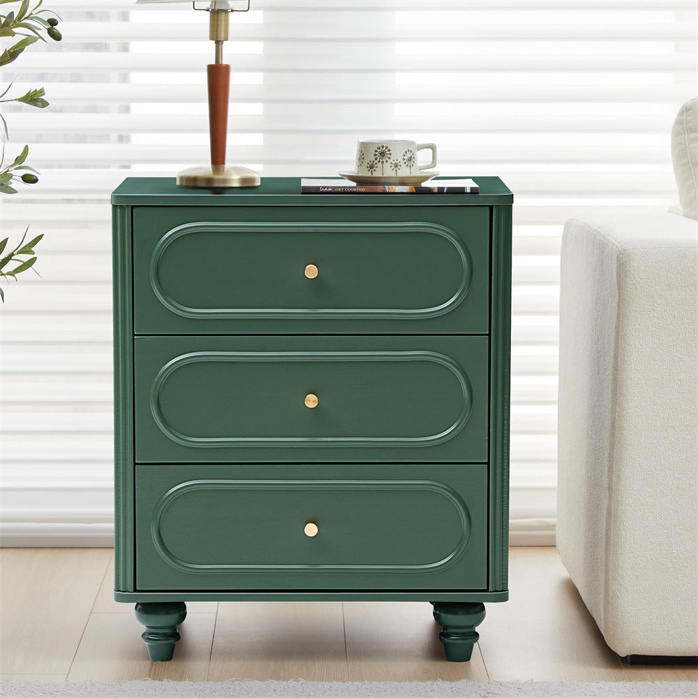 Green nightstand with three drawers in a room setting