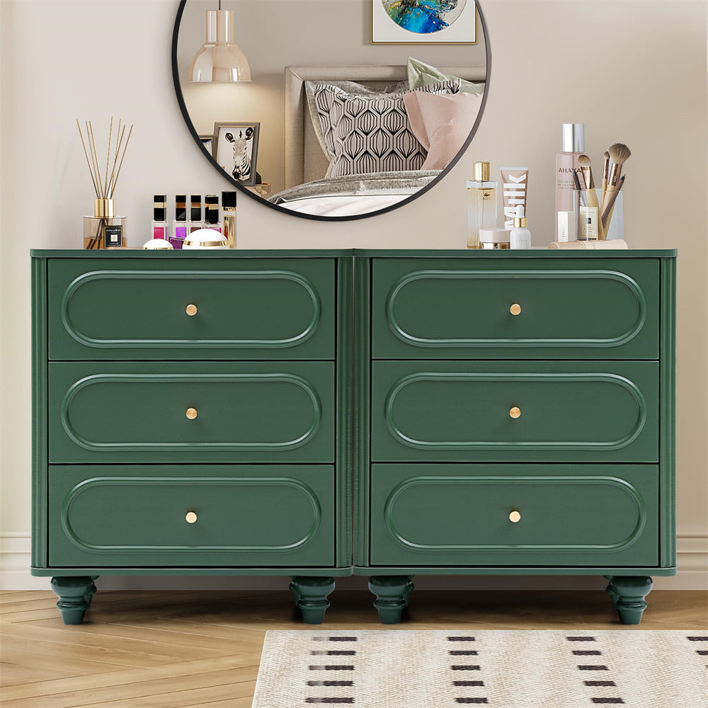 Green dresser with four drawers in a room setting