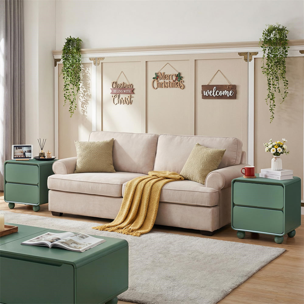Living room with beige sofa, green side tables, and Christmas decorations.