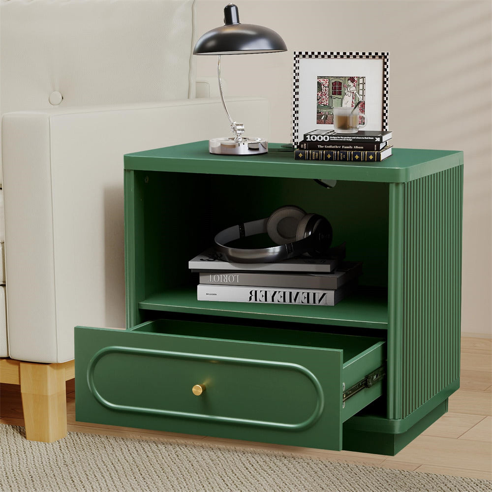 Green side table with open drawer, books, and a lamp on top.